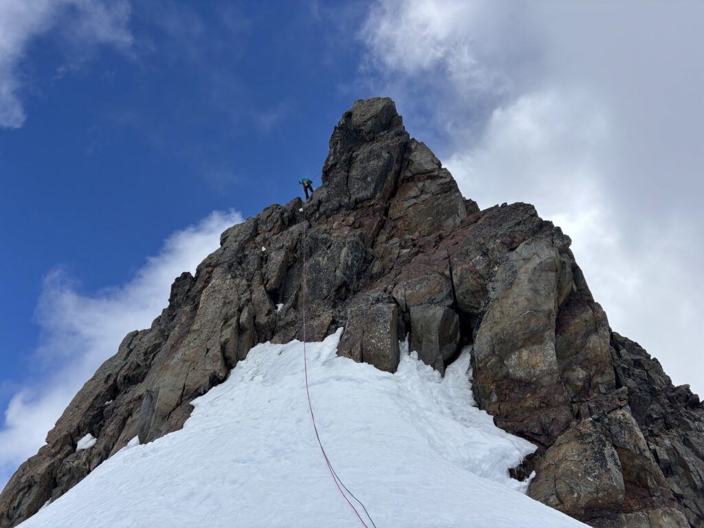 Rappelling down the summit block of Mount Olympus